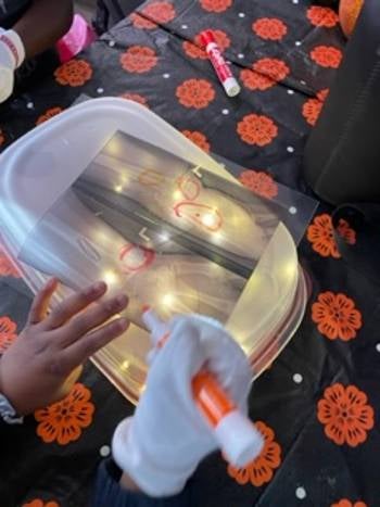 Students working at a light box. 