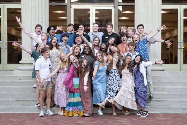 students smiling at the camera