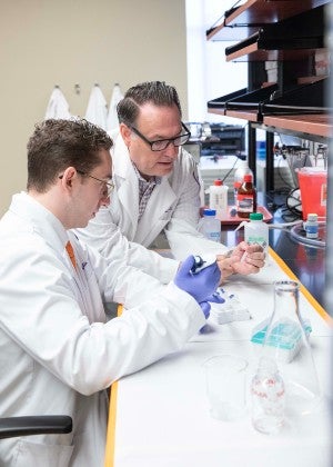 Student Lino Gaglio with Dr. Scott Daniels in Inotiv Lab
