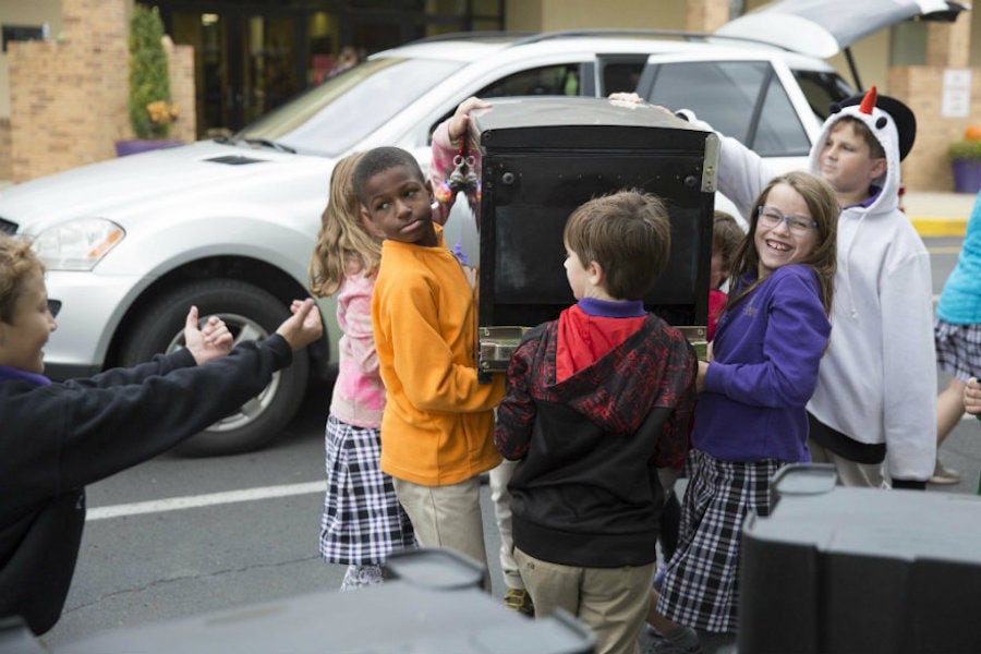 kids holding machine