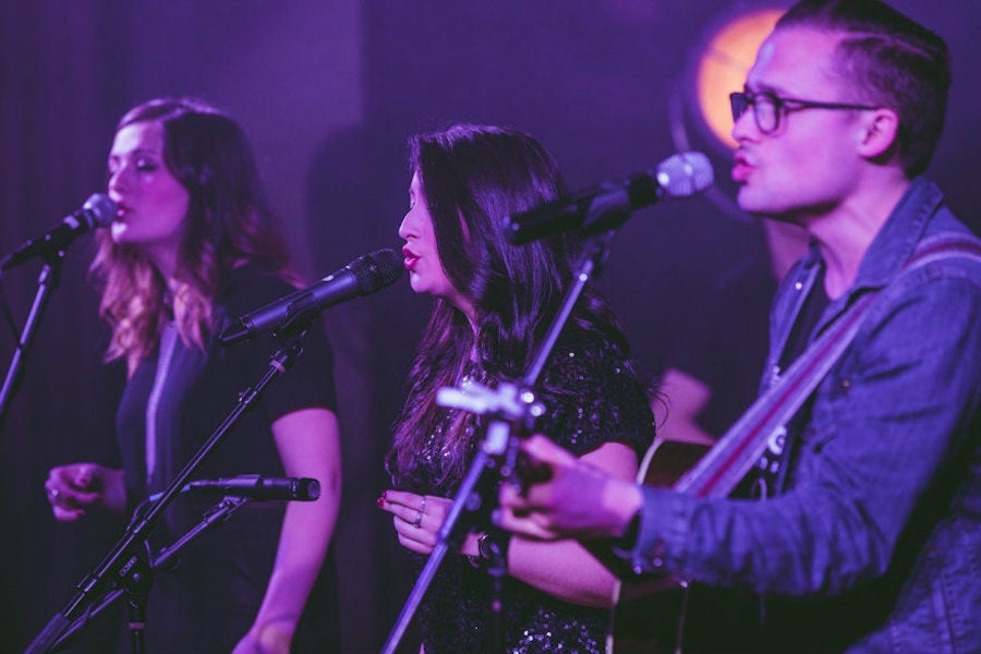 group on stage performing