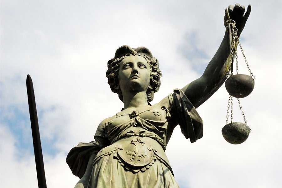 Statue of Lady Justice in the Romerplatz of Frankfurt, Hessen, Germany.