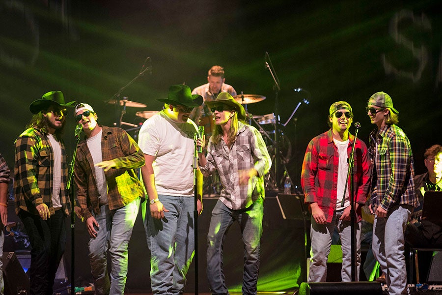 Members of Tau Phi perform during the annual cowboy show.