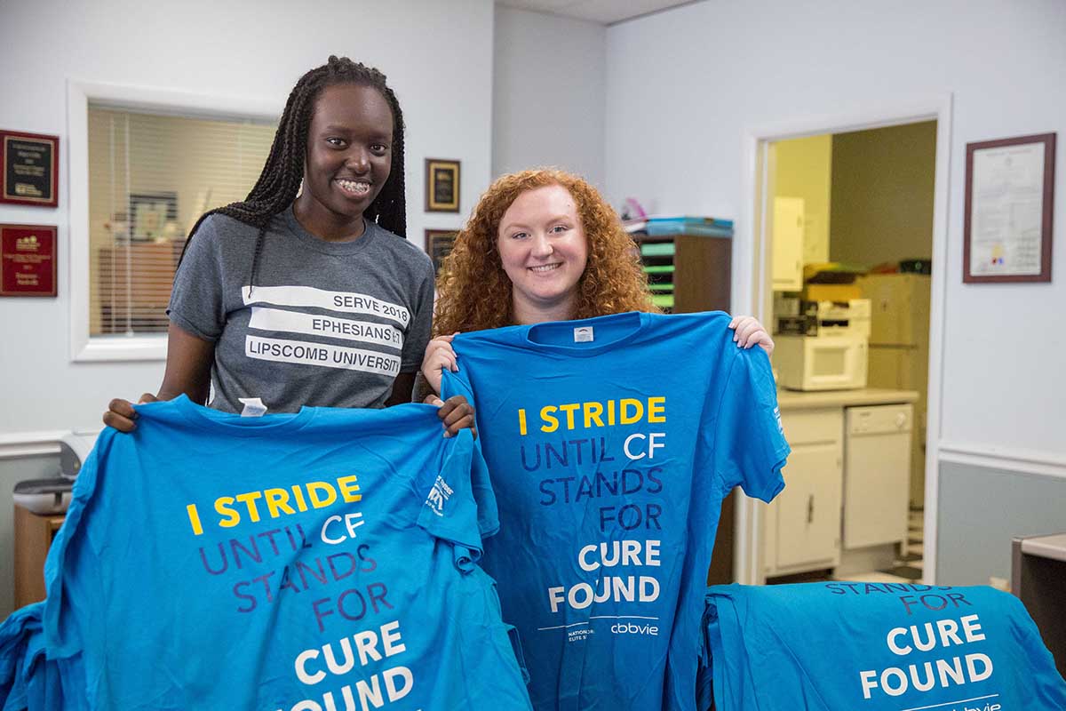 Students show off t-shirts for a cause