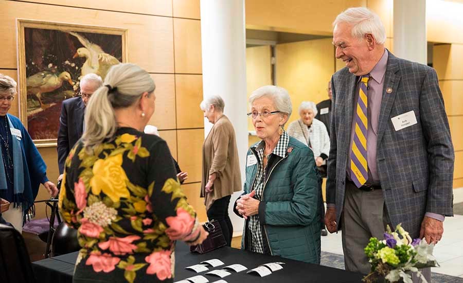 alumni arrive for a reunion