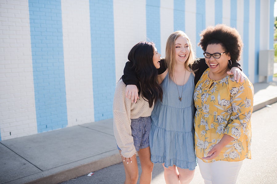 Three students on a shopping trip together outside Draper James