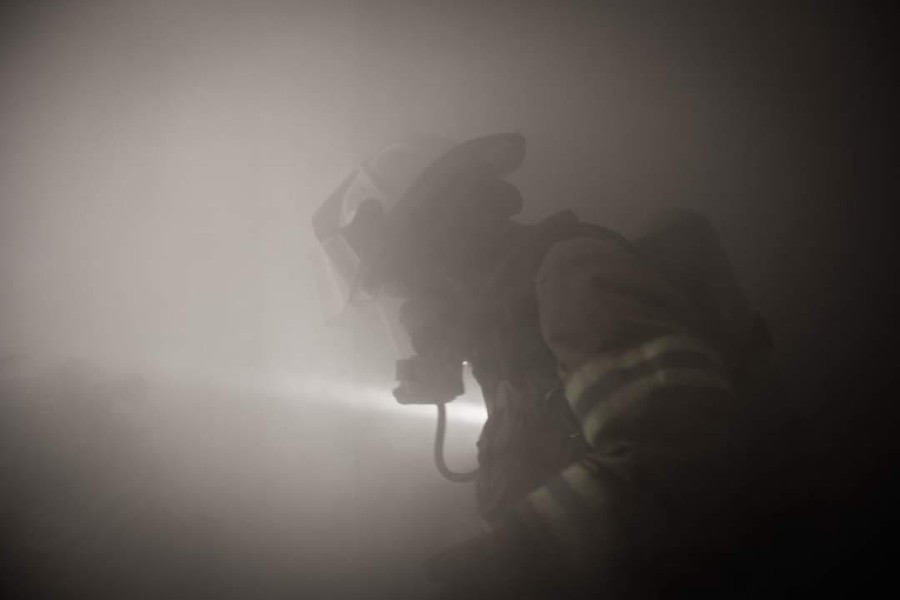 A firefighter seen through Foggy's Fog smoke