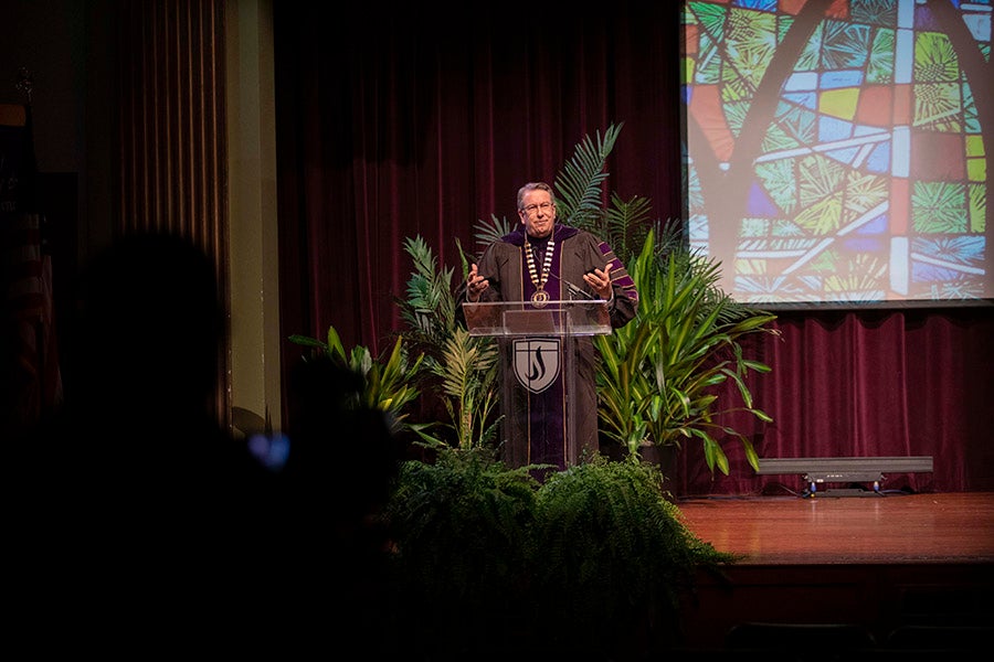 Lipscomb President L. Randolph Lowry behind the podium in Collins during filming of the commencement ceremony.