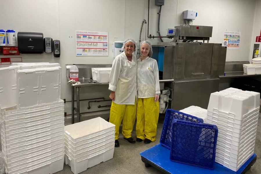 Lipscomb's dietetic interns in front of the dishwashing machine