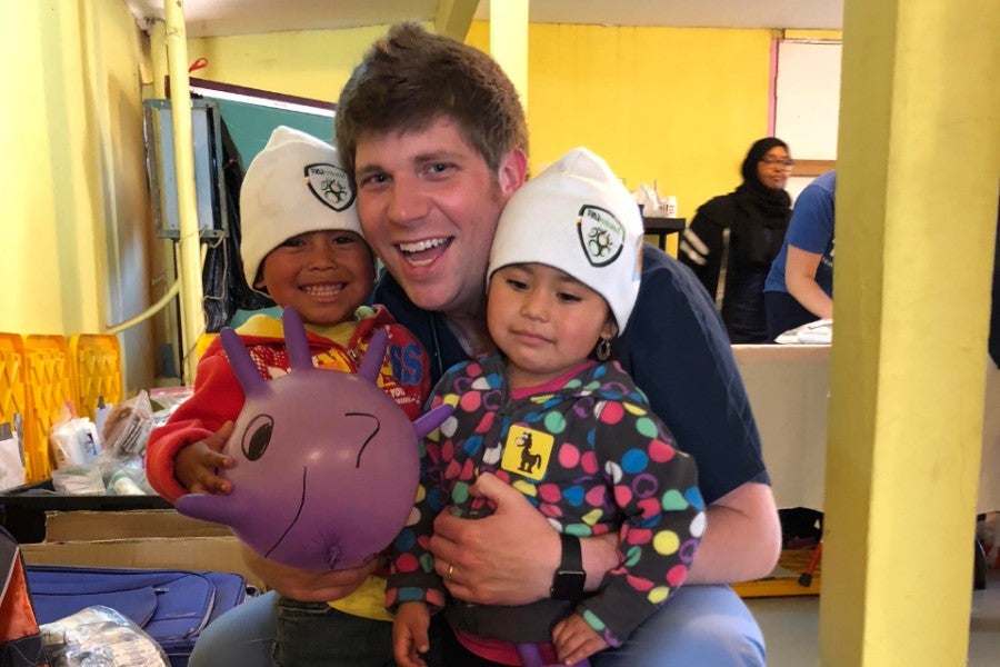 Dr. James Parnell with children in Baja, Mexico