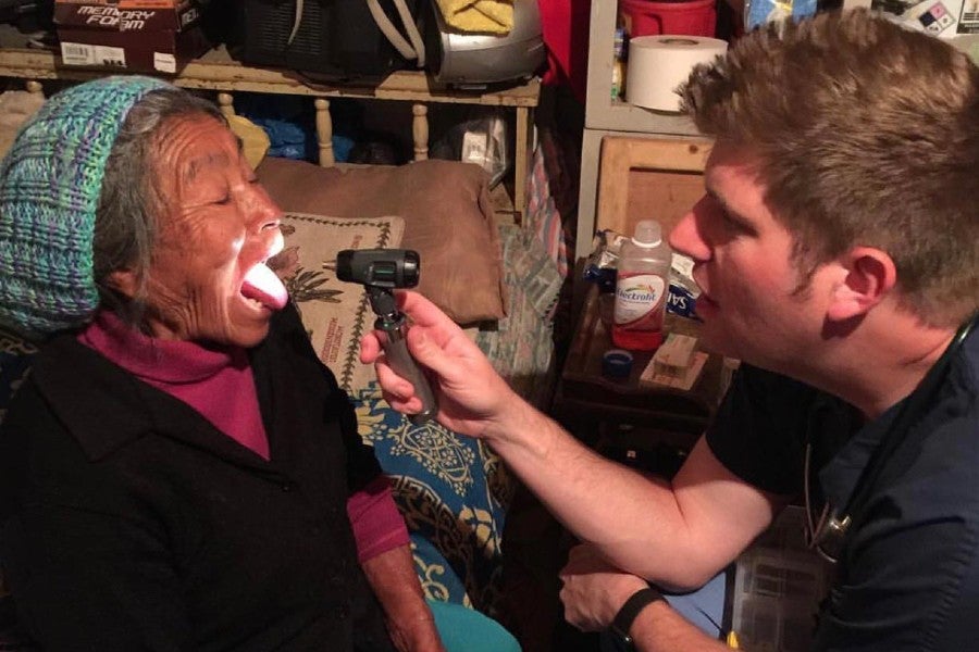 Dr. James Parnell examines a patient on a mission trip in Baja, Mexico