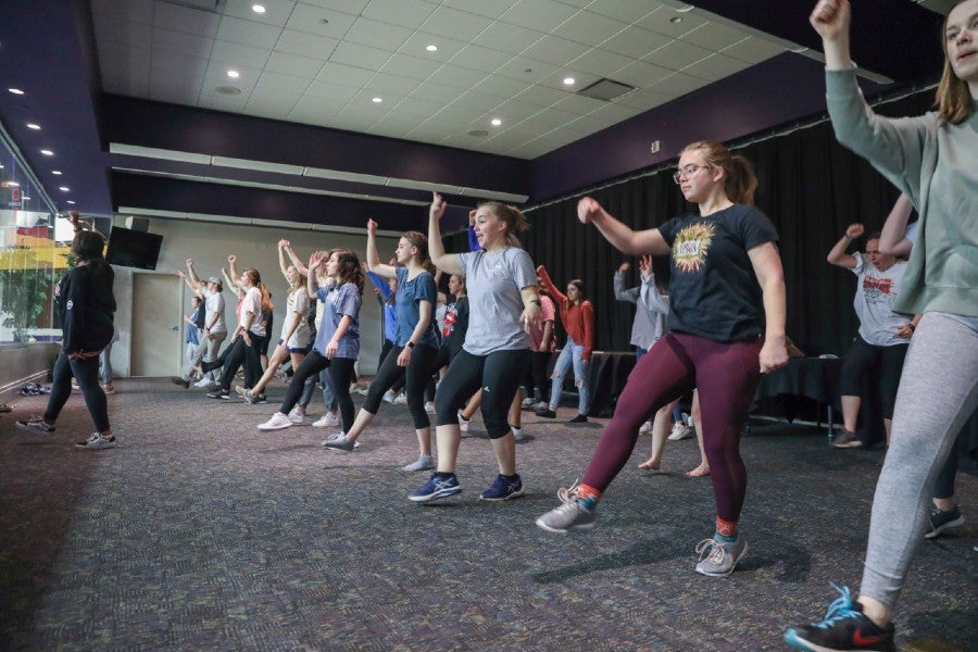 Students rehearse for "A fresh Pair of Eyes" in the Hall of Fame Room,