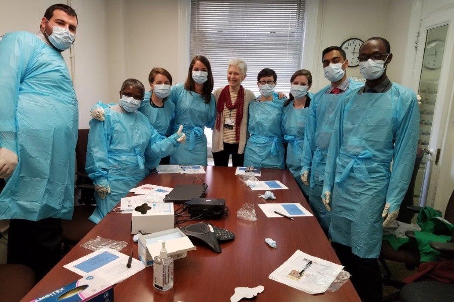 Kayla Ford with Lenox Hill interns in PPE