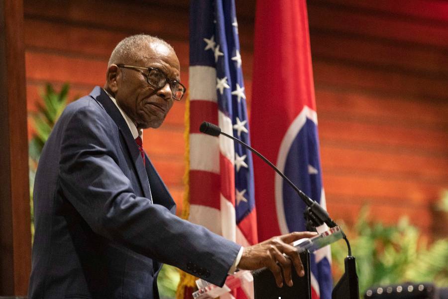 Fred Gray in front of a podium