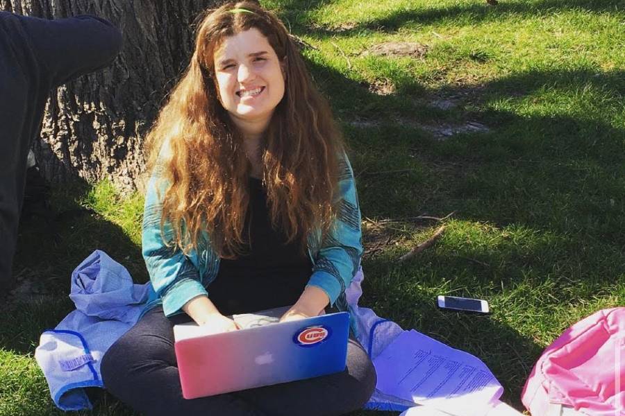 Shayla Osborne sitting in the grass