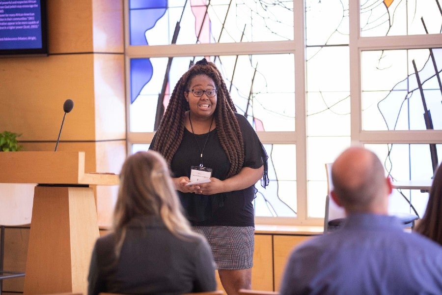 Students presenting at the symposium