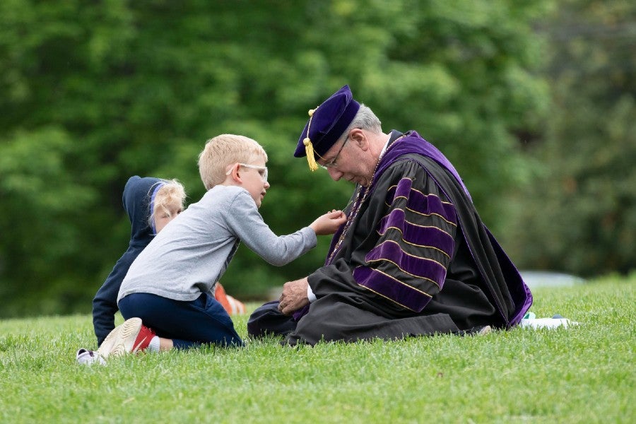 President Lowry's Grandchildren look at the official medallion