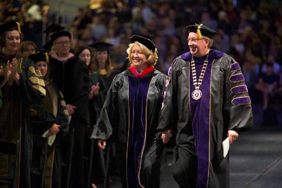 Randy and Rhonda Lowry walking in at Convocation
