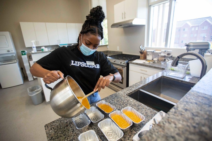 Nutrition interns baking in the nutrition lab