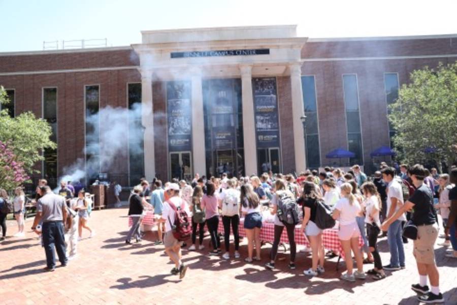 Students enjoy a cookout on Bison Square. 