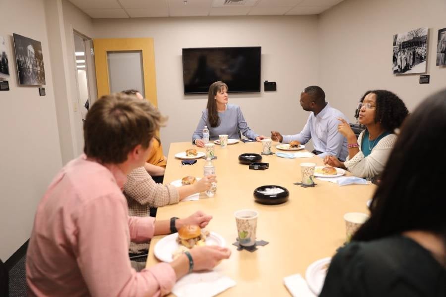 Dr. McQueen eats lunch with representatives of student organizations. 