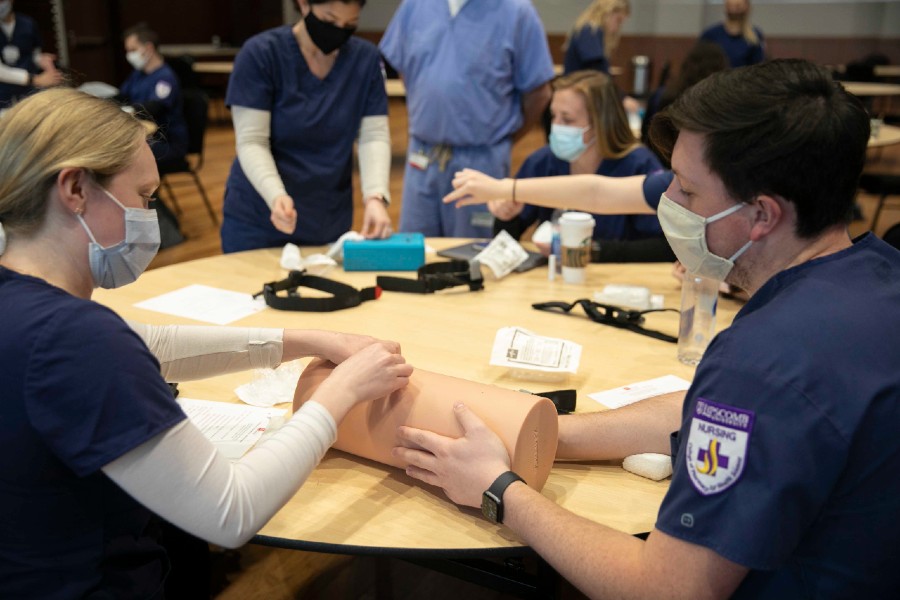 Nursing students learning to stop a hemorrhage