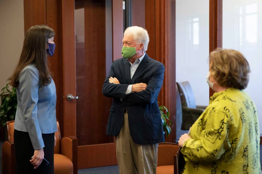 Dr. McQueen meets board member Mike Adams and wife