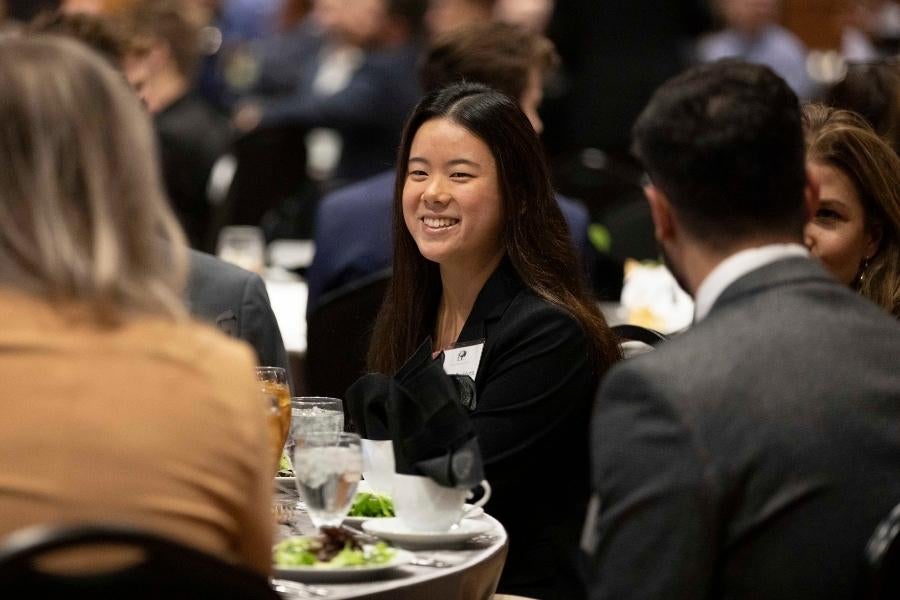 student enjoying meal at declaration dinner