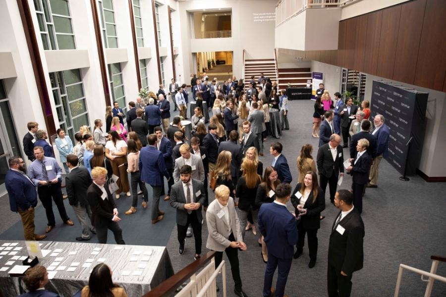 students and alumni networking at dinner