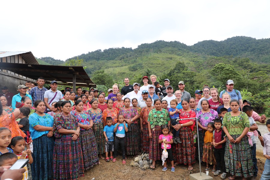 members of the mission team and residents of the village