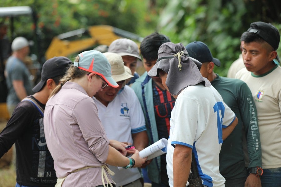 Lipscomb, Garney and village residents confer on a step in the process