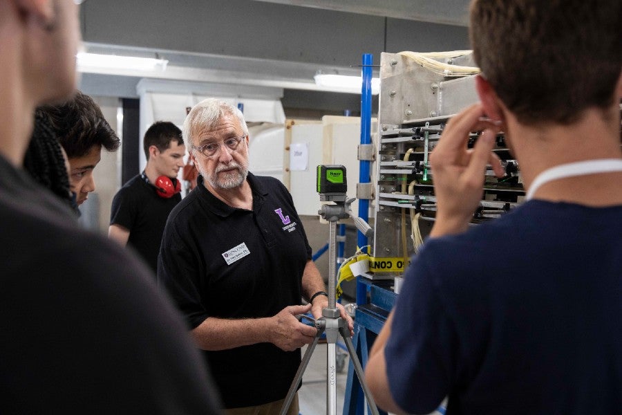 Students learning from engineering faculty