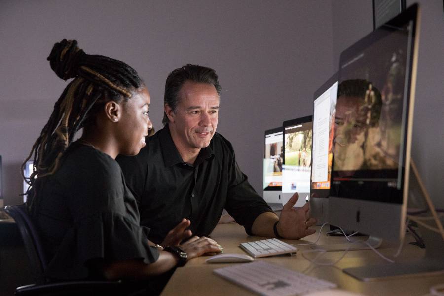 Mike Nawrocki works with an animation student.