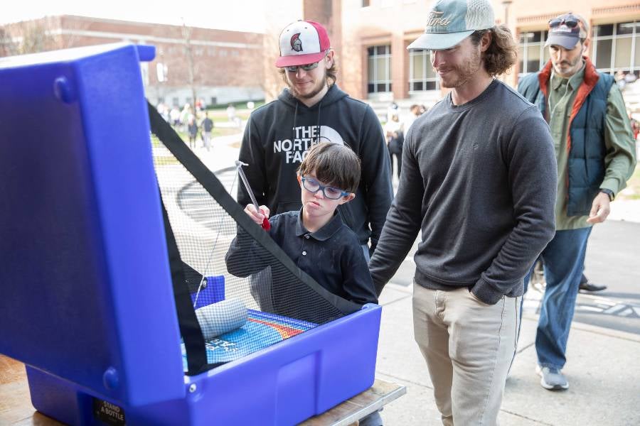 Boy playing a game at the block party