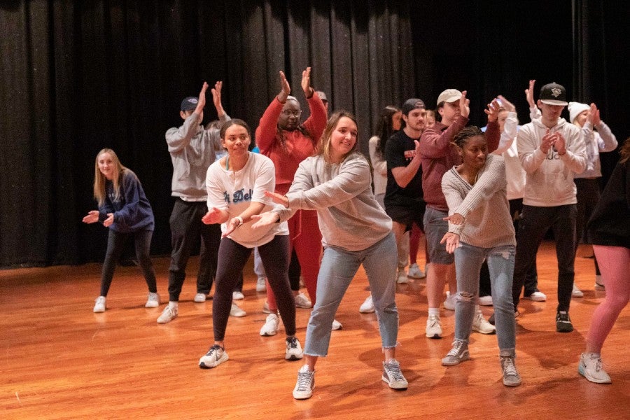 Students rehearsing for the Mystery show