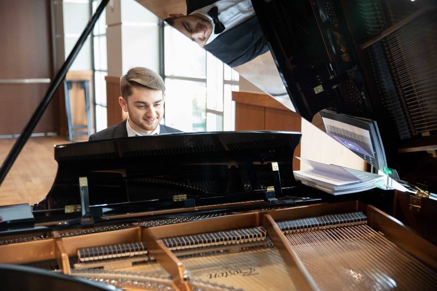 Student playing the piano