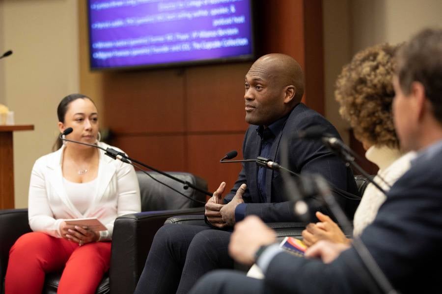 Cyntoia Brown talks to business symposium panelists