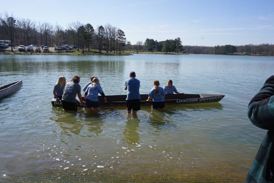 Students about to get into the concrete canoe