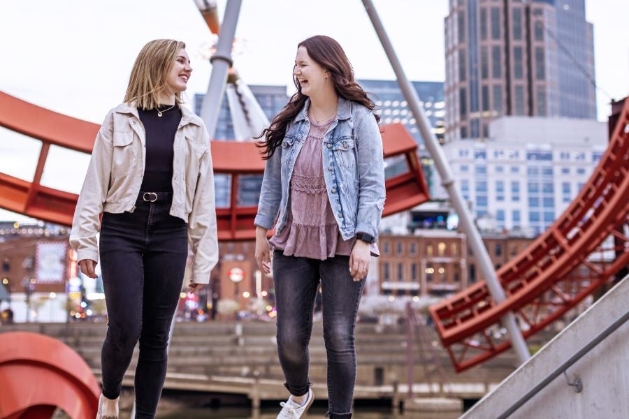 Girls walking and talking together at Riverfront Park.