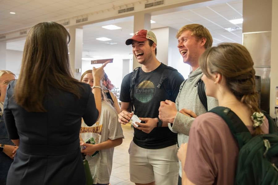 Dr. McQueen with students at brunch