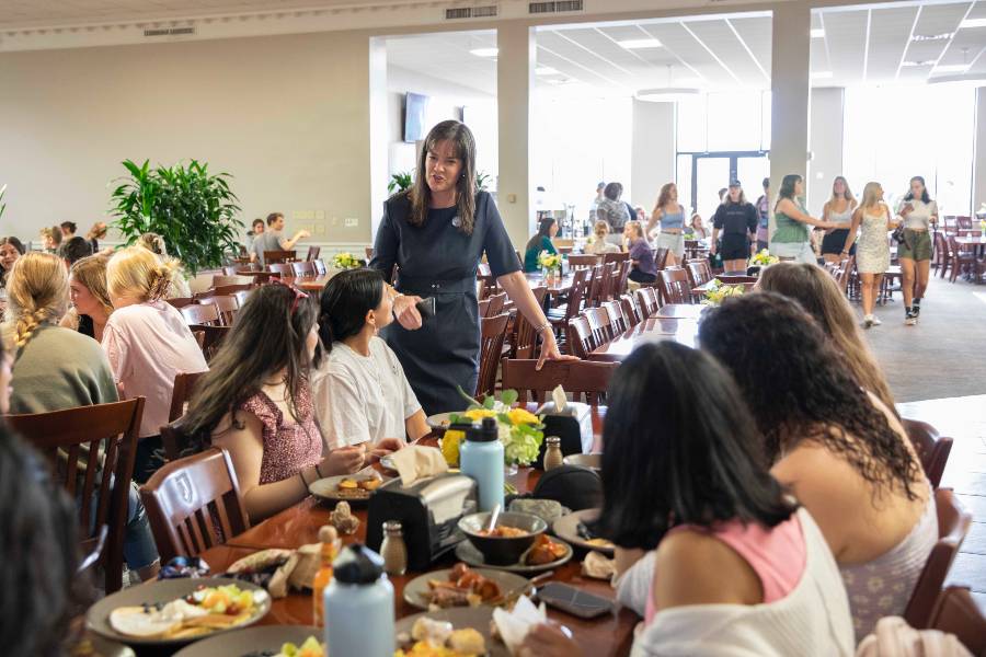 Dr. McQueen with students at brunch