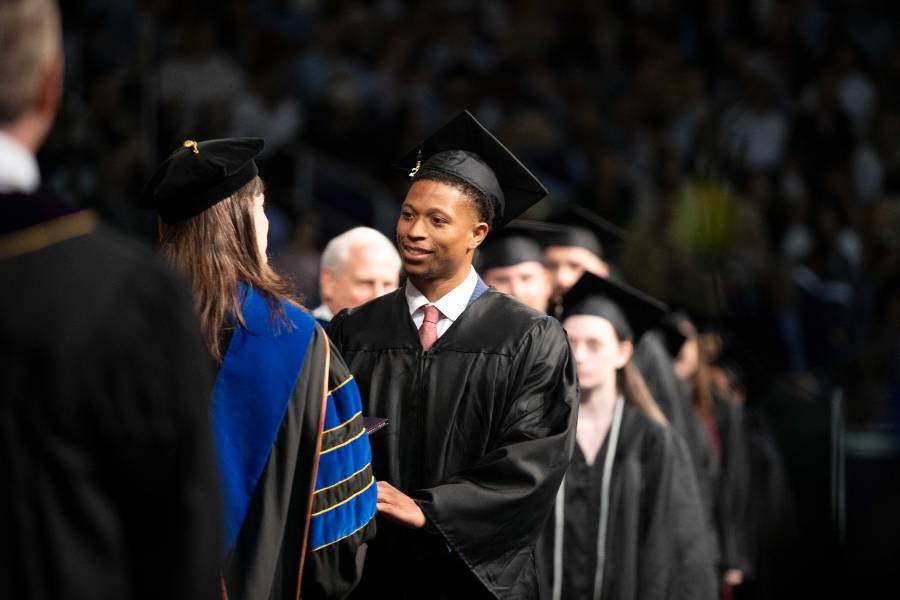 Male student receives diploma