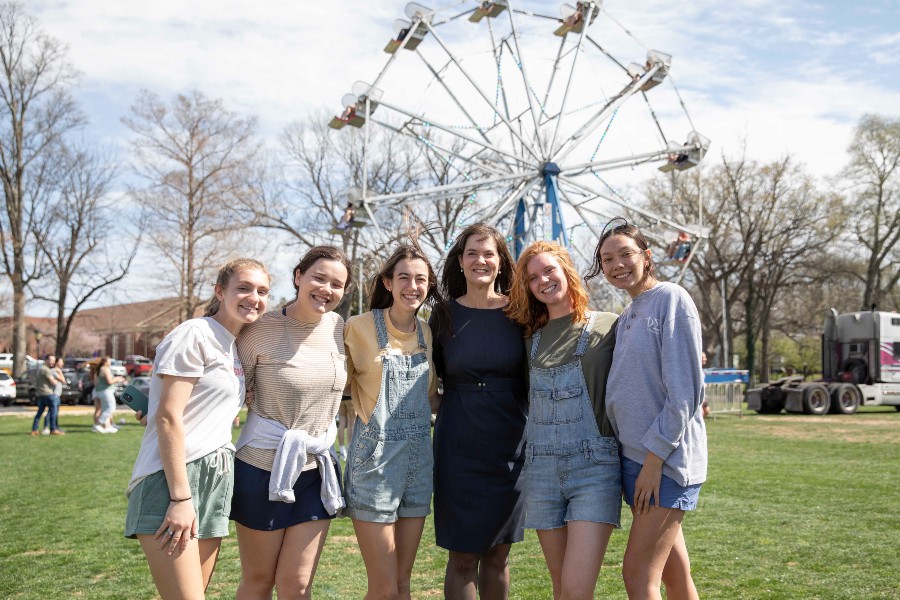 President McQueen with students at the Beautiful Day fair