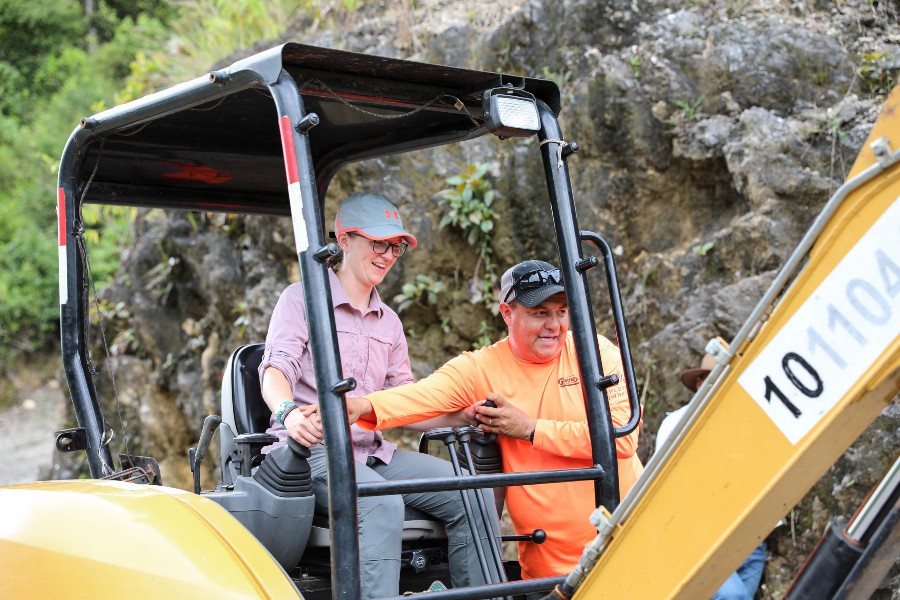 Kristen on an Excavator digging 