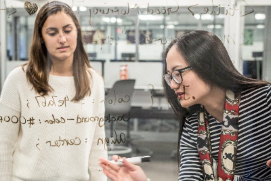 Teacher and Student looking at Data