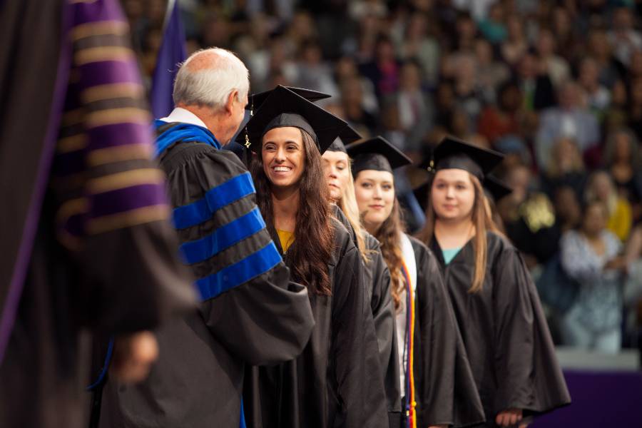Provost Bledsoe presiding over commencement.