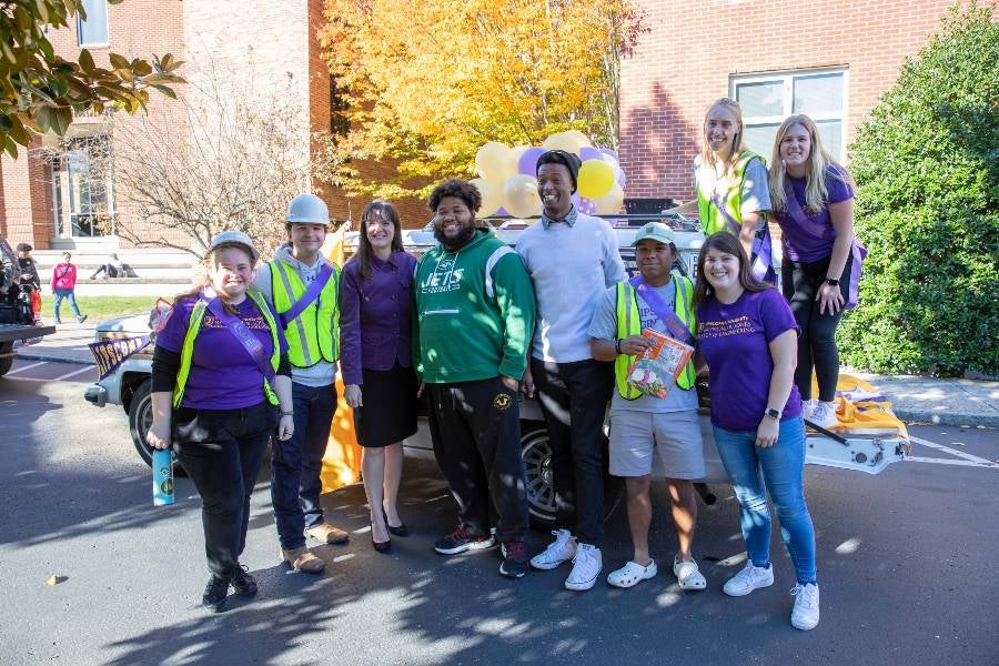 President McQueen with students at Homecoming.