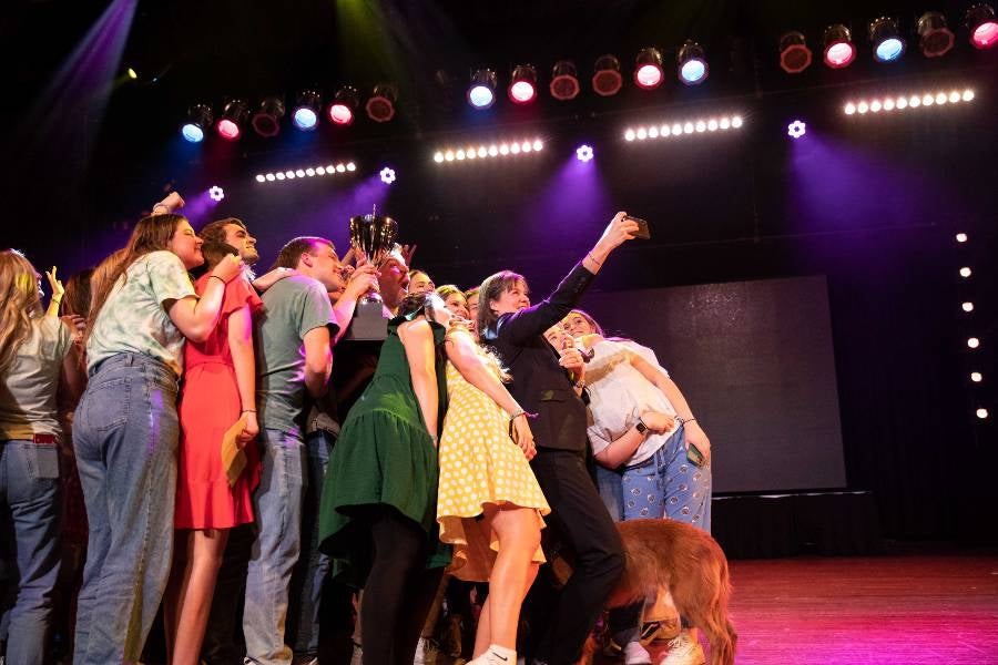 President McQueen takes a selfie with students after the Singarama finale.