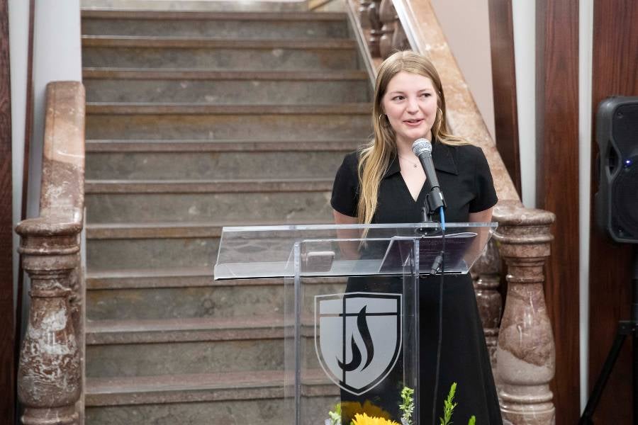 Student speaking at ceremony