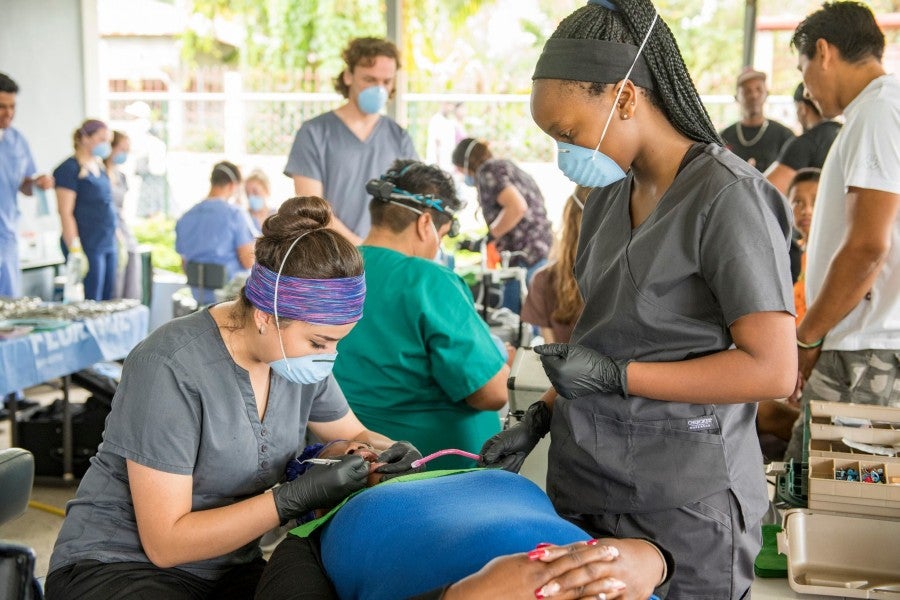 Lipscomb students working at a dental clinic